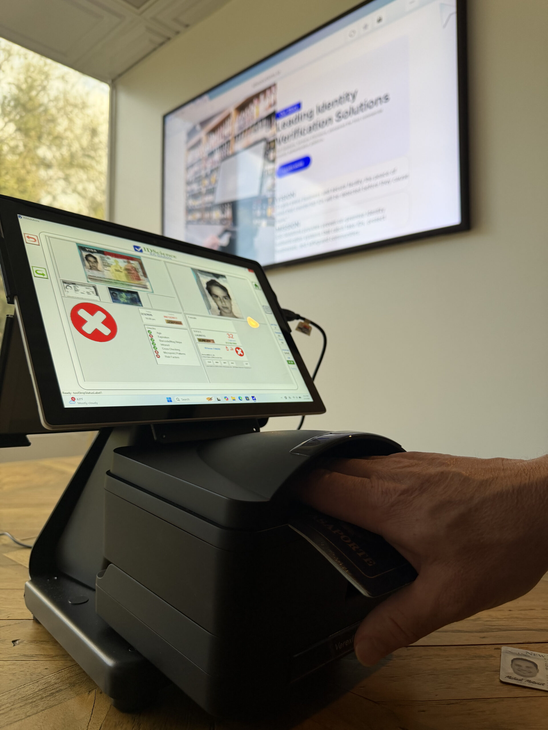 IDS-Solutions identity verification software displayed on kiosk with VerexID ARIA scanner for ID and passport scanning